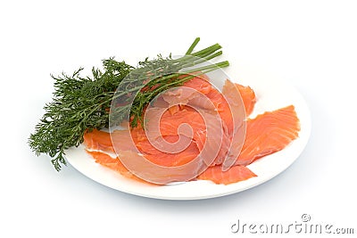 Slices of smoked fish with fennel on a plate Stock Photo