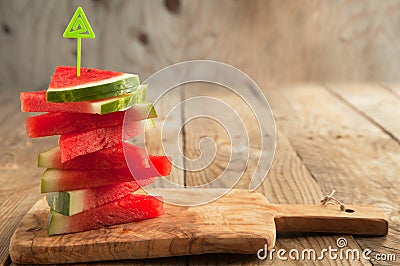 Slices of watermelon on chopping board Stock Photo