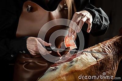 Slicing Spanish jamon iberico. Spanish jamon and traditional food Stock Photo