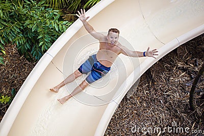 Sliding down a fun water slide at a waterpark Stock Photo