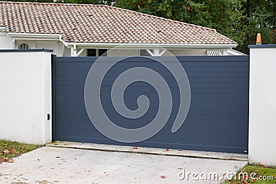 Sliding gate modern aluminum portal to home access Stock Photo