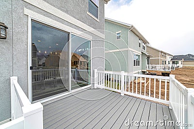 Sliding glass door at the deck of home with scenic view of the neighborhood Stock Photo