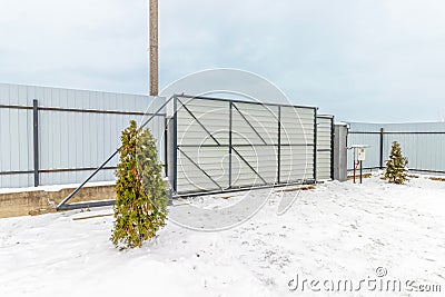 Sliding Metal Gate with Automatic Opening, Winter, Snow Stock Photo