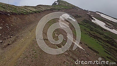 Sliding by way to the top of mountain in summer Stock Photo