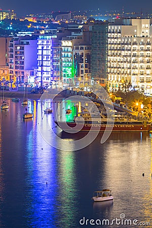 Sliema, Malta - January 9, 2020: Architecture of the harbor in Sliema city at night, Malta Editorial Stock Photo