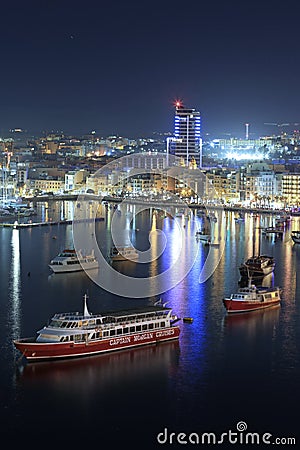 Sliema, Malta - January 9, 2020: Architecture of the harbor in Sliema city at night, Malta Editorial Stock Photo