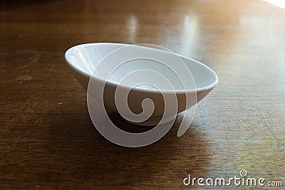 Slighly skew empty white ceramic sauceboat Stock Photo