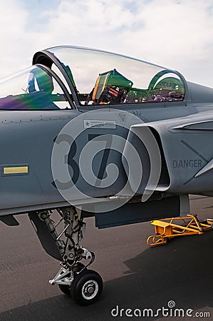 Slightly open canopy and visible ejection seat of military jet airplane Stock Photo