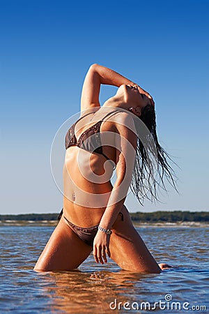 Slim girl bends her body Stock Photo