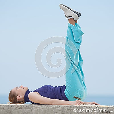 Slim girl does morning exercises Stock Photo