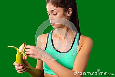 Slim refined muscle girl making fitness and follow a healthy diet for her figure to maintain it in a good form. Stock Photo