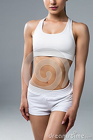 Slim waist of young sporty woman. Detail of perfect fit female body Stock Photo