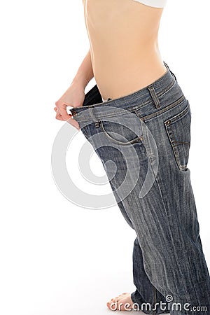 Slim woman in oversized big pants lost weight Stock Photo