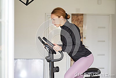 Slim women doing cardio at home Stock Photo