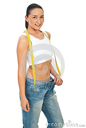 Slim young woman in big jeans Stock Photo