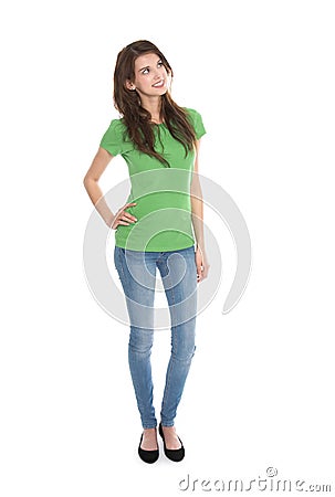 Slim young woman wearing green shirt and blue jeans in full body Stock Photo