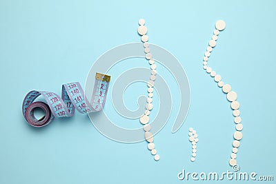 Slimming with pills, fat burner. Weight loss concept, slim your body without exertion. Vitamin drugs Stock Photo