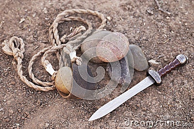 The Sling of David with Five Smooth Stones and Goliaths Sword Stock Photo