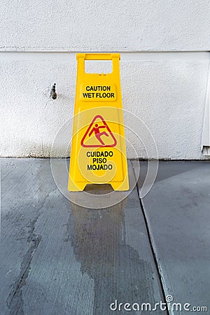 Slippery floor surface warning sign and symbol in building, hall Stock Photo