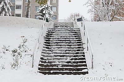 Slippery stairs after first snow in park Stock Photo