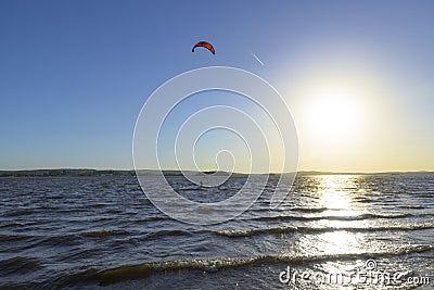 Slipping through the waves with a parachute Stock Photo