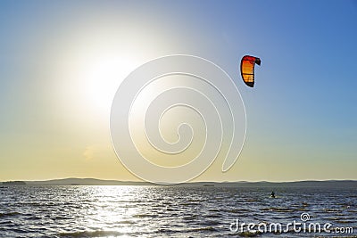 Slipping through the waves with a parachute Stock Photo