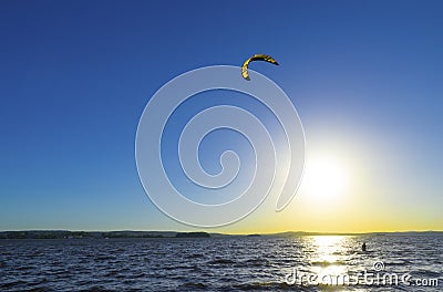 Slipping through the waves with a parachute Stock Photo