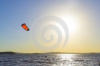 Slipping through the waves with a parachute Stock Photo