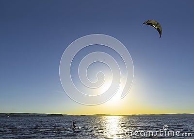 Slipping through the waves with a parachute Stock Photo