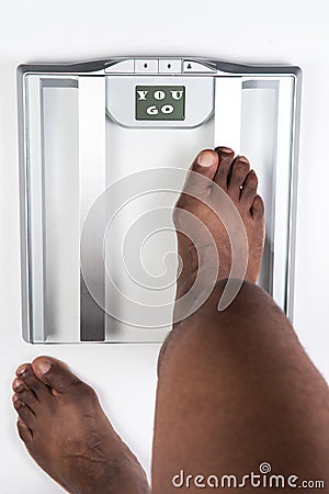 Sliver bathroom scale with green measuring tape on white background. Health and weight loss Concept Stock Photo