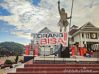 the slogan and logo of the XX Papua PON 2021 installed against the background of the ANIM-HA statue Editorial Stock Photo