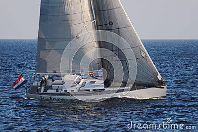 Sloop sailboat USA 18 sailing in open waters. Editorial Stock Photo
