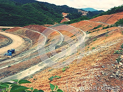 Slope cutting with berm drains Stock Photo