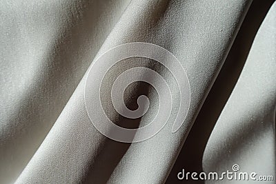 Sloping soft folds on light grey chiffon Stock Photo