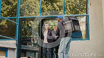 Sloppy fastfood carrier dropping pizza boxes Stock Photo