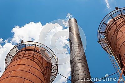 Sloss Furnaces National Historic Landmark, Birmingham Alabama USA, two furnaces and smokestack reach skyward against a brilliant b Stock Photo
