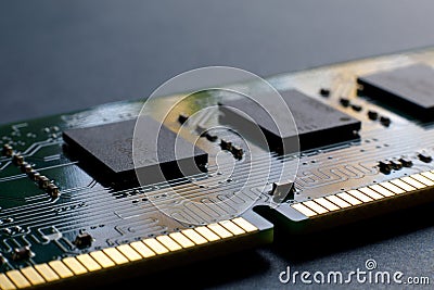 A slot key notch, contacts, connecting tracks and microchips of a computer RAM Random Access Memory modules close-up for Stock Photo