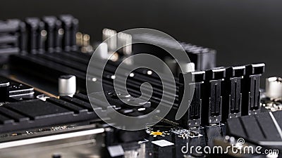 Slot latches for installing DDR5 RAM on the motherboard of a modern computer. Photo. Selective focus Stock Photo