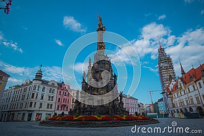 Sloup Nejsvetejsi trojice or Holy trinity sculpture on a town square in Olomouc, Czech republic on a sunny day with some clouds. Stock Photo