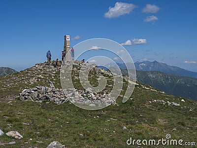 Slovakia, Western Tatra mountain, July 4, 2019: group of hiker people resting on top of Baranec peak in Western Tatra Editorial Stock Photo
