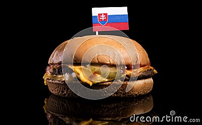 Slovakian flag on top of hamburger on black Stock Photo