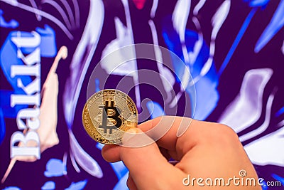 Holding Bitcoin coin with Bakkt website Editorial Stock Photo