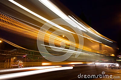 Slow exposure of a passing tram at night with light trails. Editorial Stock Photo