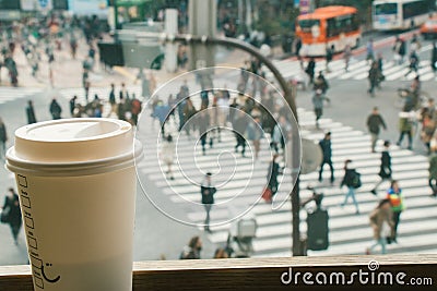 Slow life, Coffee time in rush hour of Big City, blur of people Stock Photo