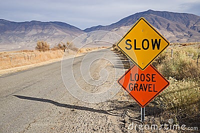 Slow Loose Gravel Sign Along Rural Road Stock Photo