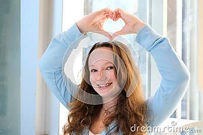 Slow motion close up portrait of an adult woman,smiling presenting with her optimistic,carefree ,vibrant attitude and Stock Photo
