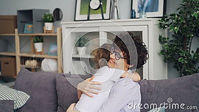 https://thumbs.dreamstime.com/x/slow-motion-loving-mother-little-son-hugging-sitting-sofa-home-expressing-love-happy-family-feelings-positive-143609363.jpg