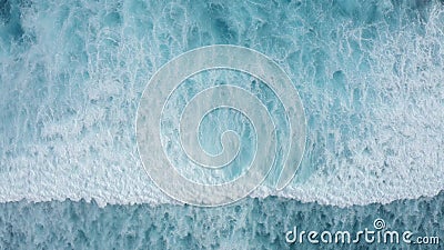 Slow-motion top down aerial view of the ocean giant waves, foaming and splashing. Beautiful water texture background, sunny day over the sea, drone footage stock footage Slow-motion top down aerial view of the ocean giant waves, foaming and splashing. Beautiful water texture background, sunny day over the sea, drone footage stock footage