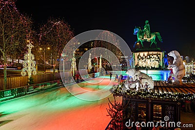 Night scenery at ice rink with people enjoy ice skating at Heumarkt, famous Christmas market square in KÃ¶ln. Editorial Stock Photo