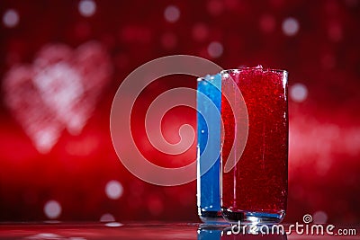 Slush ice in glasses, red and blue on glitter star Stock Photo